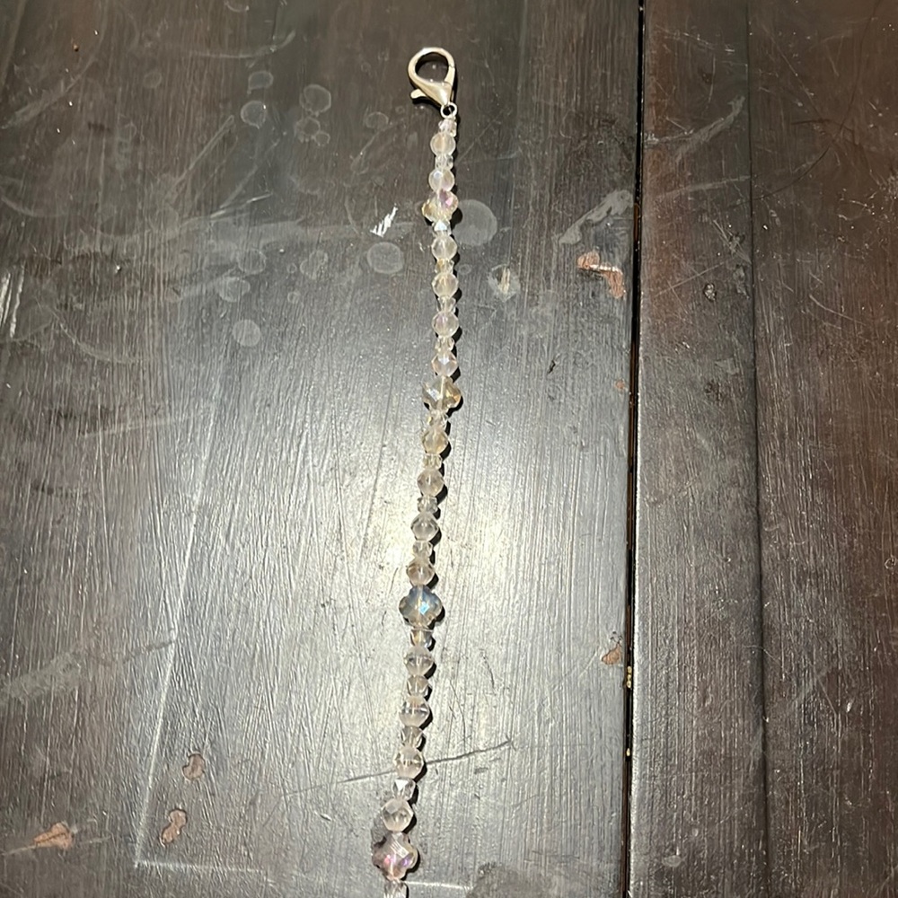 Charm. Keys or purses..